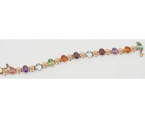 A multi-gem set bracelet stamped '18K' with eleven various coloured, oval stones to include amethyst and garnet:. 
