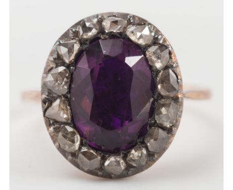 An Amethyst coloured paste & rose diamond oval cluster ring:. 
