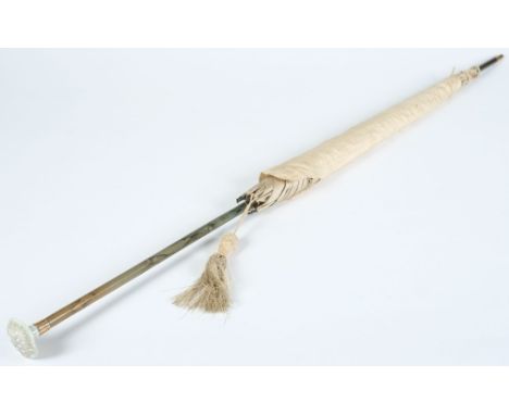 A silk parasol with faux bamboo and jade handle:.
