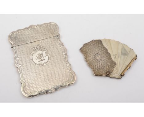 A Victorian silver visiting card case, maker Hilliard & Thomason, Birmingham, 1857: crested, of rectangular outline with engi