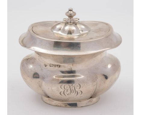 An Edward VII silver tea caddy, maker Richard Martin & Ebenezer Hall, Chester, 1909:, initialled, of oval lobed form, the hin