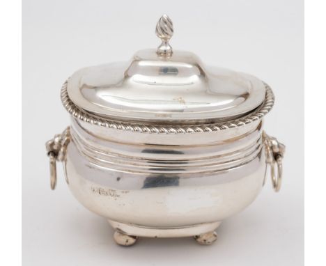 A George V silver tea caddy, makers mark worn, Chester, 1912: of barge shaped outline with gadrooned rim and lion mask handle