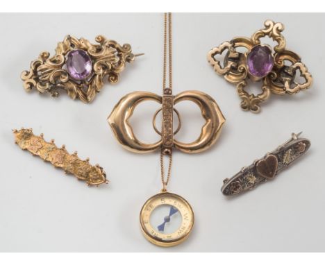 Four gold and gold plated brooches, a silver sweetheart brooch and a compass pendant on chain:. 