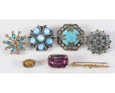 A gold mounted rectangular amethyst brooch, an oval citrine and seed pearl surround brooch, a bar brooch and four costume bro