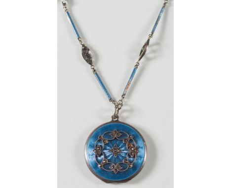 A blue enamelled silver and marcasite-set circular locket: on enamelled chain. 