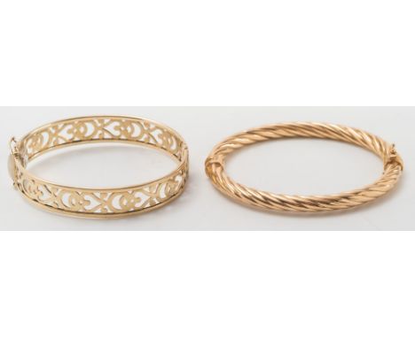 A 9ct gold hinged bangle of pierced design and a gold rope-twist design bangle:.