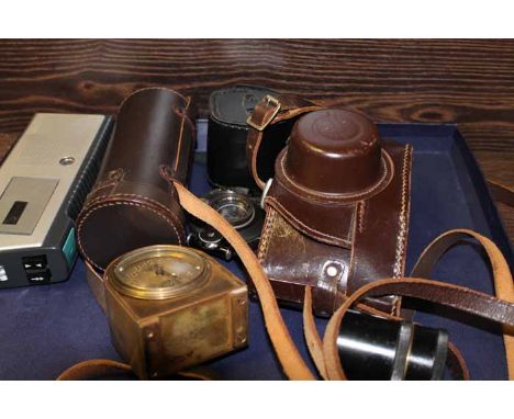 CAMERAS, LENSES AND A BRASS ALARM CLOCK