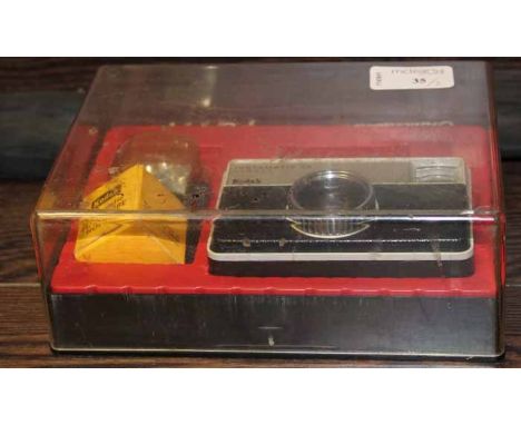 KODAK INSTAMATIC CAMERA WITH INSTAMATIC FLASH CUBE HOLDER AND ORIGINAL BOX
together with a GLFY 8'0" #5/6 weight fishing rod 
