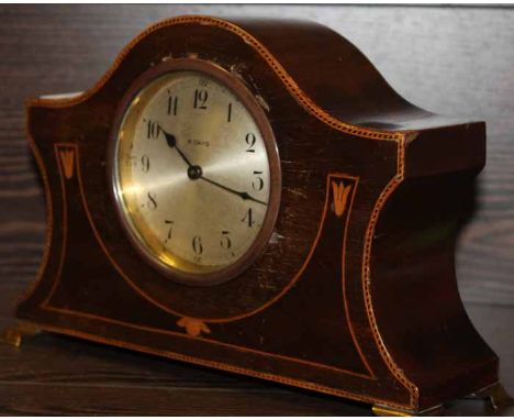 MAHOGANY INLAID MANTLE CLOCK
with inlaid face and edges, with brass 8-day movement and brass bracket feet, 24cm long