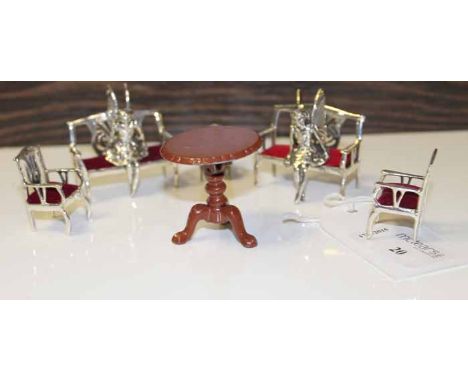 COLLECTION OF SILVER MINIATURE FURNITURE
including two pierced back benches, and two similar armchairs, upholstered in red ve