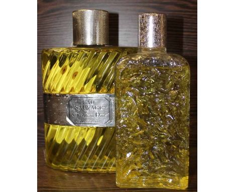 TWO LARGE PERFUME DISPLAY BOTTLES
one with label for Christian Dior 'Eau Sauvage,' the other lacking label