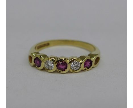 A 9ct gold, ruby and diamond five stone ring, 2.2g, N