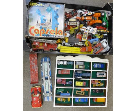 A collection of die-cast model vehicles, mainly Matchbox, a Britains tractor and a Japanese Capsela robot toy, boxed