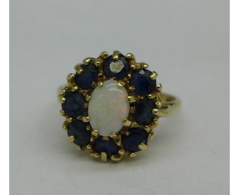 A 9ct gold, opal and sapphire ring, 3.2g, K