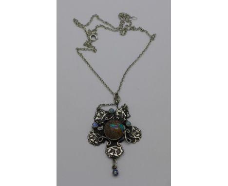 A white metal and opal set Arts and Crafts pendant on a .925 silver chain