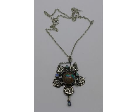 A white metal and opal set Arts and Crafts pendant on a .925 silver chain