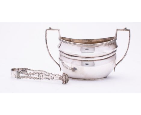 A George V silver two handle sugar basin by Robert Stewart, London 1913,  of barge shape with a pair of 18th century cast and