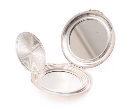 A George VI silver powder compact by Cohen & Charles, Birmingham 1950, of circular form with engine turned decoration, mirror