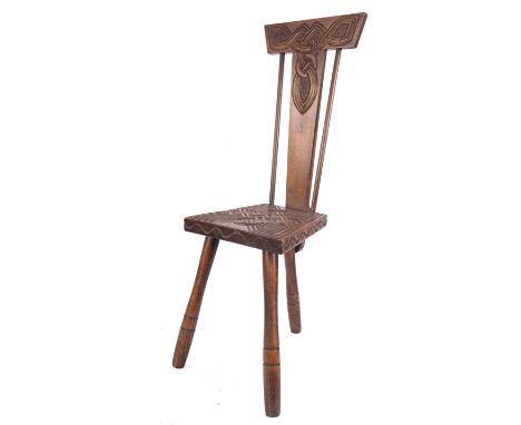 Ben Setter of Totnes, a carved and stained oak spinning chair, mid 20th century; the backrest with Celtic knot motif and twin