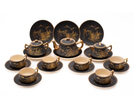 A Satsuma pottery tea service, comprising a teapot and cover, hot water jug and cover, sugar box and cover, six cups, six sau