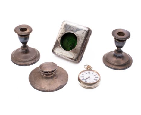 A mixed group of silver; including a pair of dwarf dressing table candlesticks, a silver capstan inkwell, a silver and leathe