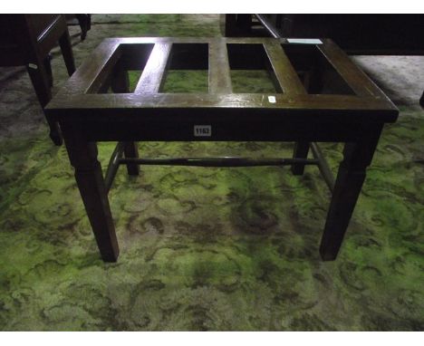 A vintage walnut luggage stand with rectangular slatted open top raised on four square cut legs together with one other