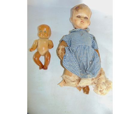 A vintage Pedigree doll together with one other