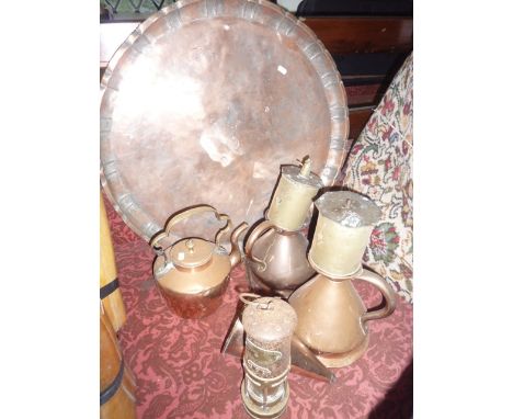 A collection of antique metal wares to include two copper measures, two brass roasting jacks, a copper ladle of conical form 