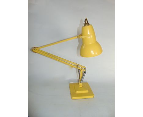 A 20th century angle poise desk lamp marked Made in England by Herbert Terry & Sons Limited, Redditch, with all over canary y