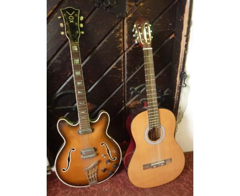 A vintage Vox electric guitar in polished timber with  mother of pearl inlay, etc, together with an acoustic guitar bearing l
