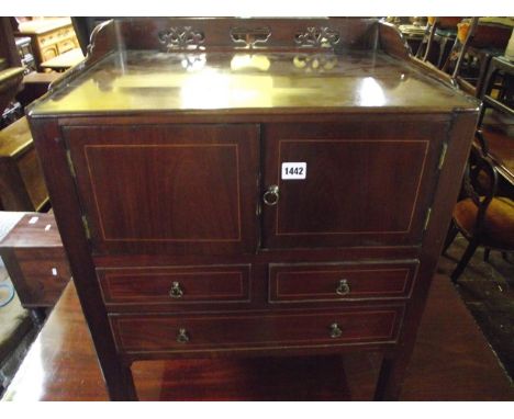 A Georgian mahogany night commode, with three-quarter gallery, enclosed mirror, the front elevation enclosed by two cupboard 