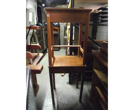 Two similar vintage child's beechwood school desks with hinged lids, together with a vintage style toy pram and two wall mirr