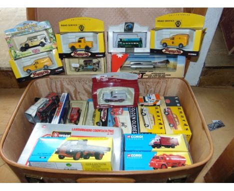 A vintage suitcase containing a quantity of boxed die cast model vehicles to include various examples by Corgi, various range