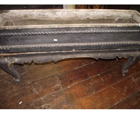 A mid 19th century jardiniere or planter, of rectangular form with rope-twist and other detail, zinc liner and raised on four