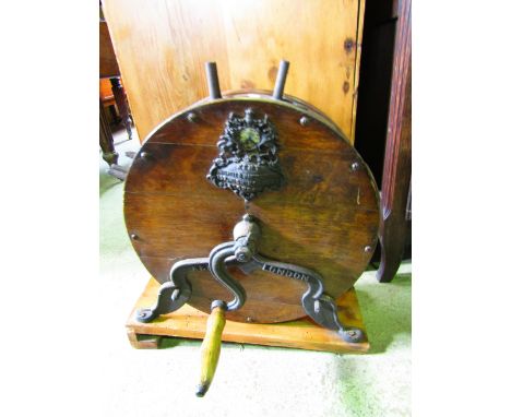 A vintage Kent London drum shaped hand operated knife cleaner/sharpener