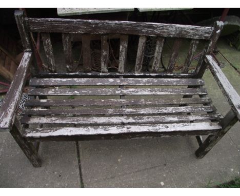 A weathered R A Lister & Co woodcraft two seat garden bench with slatted seat and back, 4ft long approx