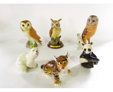 A Beswick model of a barn owl with impressed number to base 1046, two further matt glazed models of barn owls by Goebel and L