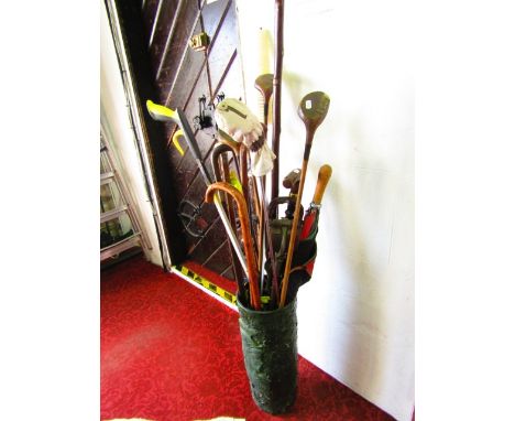 An unusual Studio ware type umbrella stand with textured finish, green glaze and applied profile study of a classical warrior