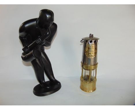 A brass and steel clad miner's lamp with applied label reading Hailwood & Ackroyd Makers Hailwood's Improved Lamp, Type 01 Mo