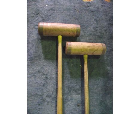 Two vintage wooden croquet mallets with brass rings