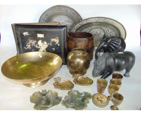 An assortment of metal wares to include eastern trays and chargers, a Chinese brass bowl, etc together with an eastern cooper