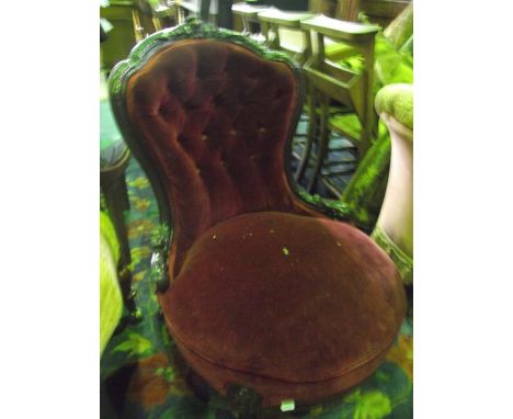 A Victorian rosewood drawing room chair with upholstered seat and button back within a shaped carved and mouled show wood fra