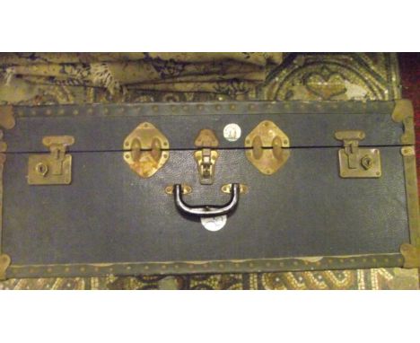 A vintage fibre cabin trunk together with a small tan leather case, two others, two cash boxes and a forged steel three prong