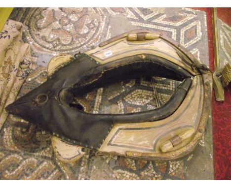 A vintage heavy horse collar, the painted wooden frame with iron fittings