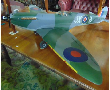 A balsa wood model Spitfire, with 1 - 4 meter wing span, complete with engine