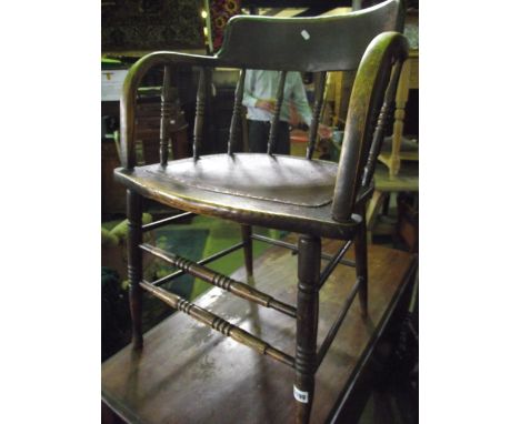 A late 19th/early 20th century ash office chair (possibly American) with bow turned spindle back, leather upholstered pad sea