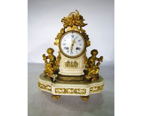 A Victorian alabaster and gilt brass mantle clock, the convex dial in enamel enclosing an eight day striking movement flanked