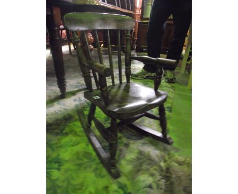 A vintage child's elm and beechwood Windsor stick back rocking chair