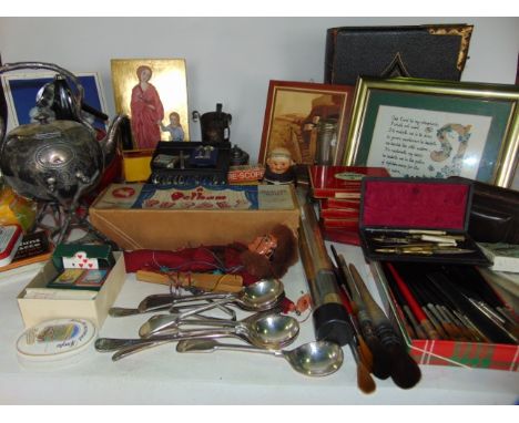 A miscellaneous collection to include various cigarette and other printed tins, silver plated cutlery, a boxed Pelham Puppet,