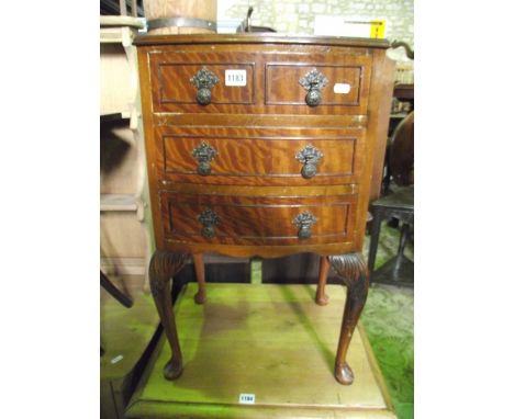 A small reproduction bow fronted bedside chest in the Georgian style of two long and two short drawers raised on cabriole sup